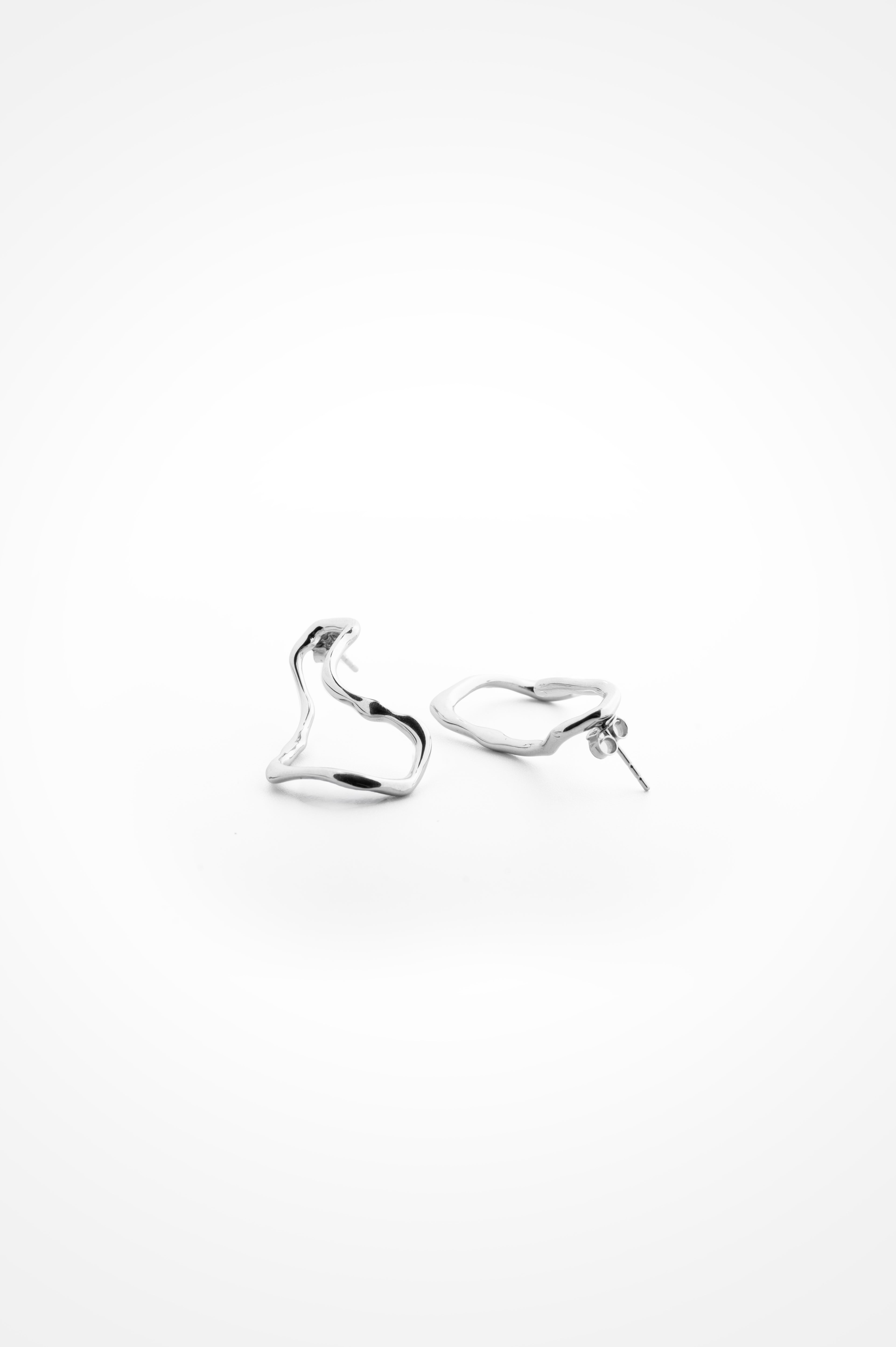 Dented Infinity Loops In Sterling Silver
